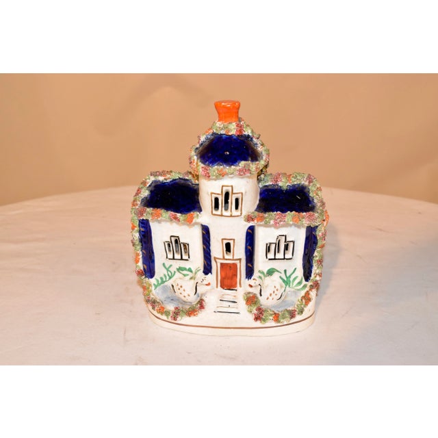 19th century Staffordshire cottage from England with swans flanking the front door and a cobalt room with flocking detail....