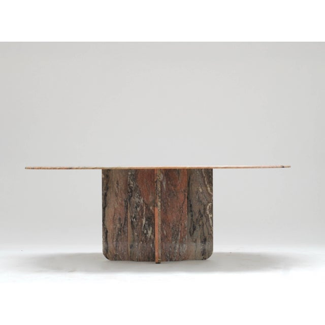 Only two examples of this table were produced from a single block of Brazilian marble by designer Georges Mathias. We can...