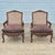 Louis XV Carved Walnut Cane Back Arm Chairs Fauteuils, A Pair Solid walnut frames with ornate high-relief carvings. Cane...