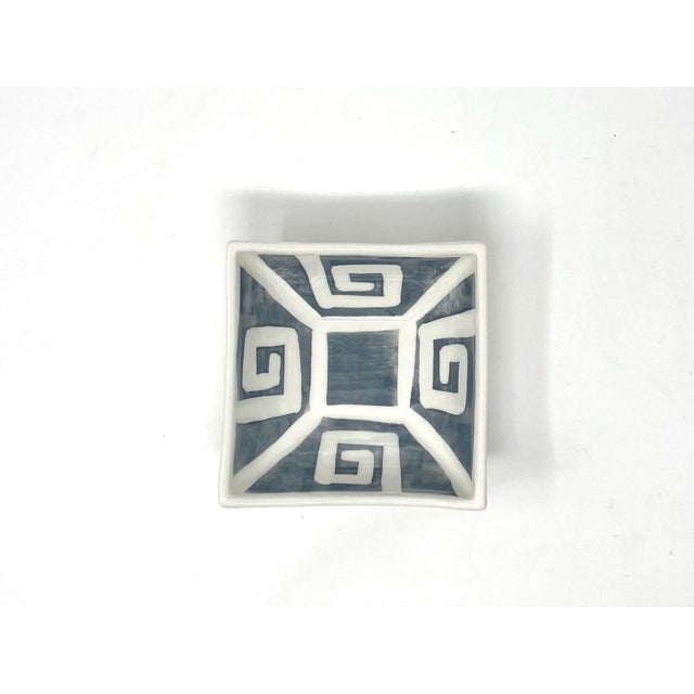 A small dip cup in a solid graphite glaze with a hand-painted Greek key border. Made in Italy. As hand-painted work,...