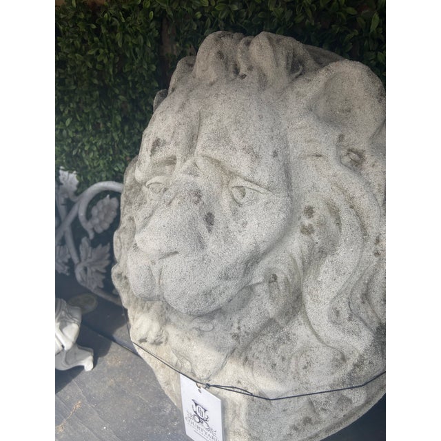 This vintage concrete lion head is durable and made to be outdoors. Perfect as a decorative focal point, it brings a...