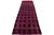 This is a handmade wool flatweave kilim rug with a dark brown field. The rug boasts an all-over geometric design in pink...