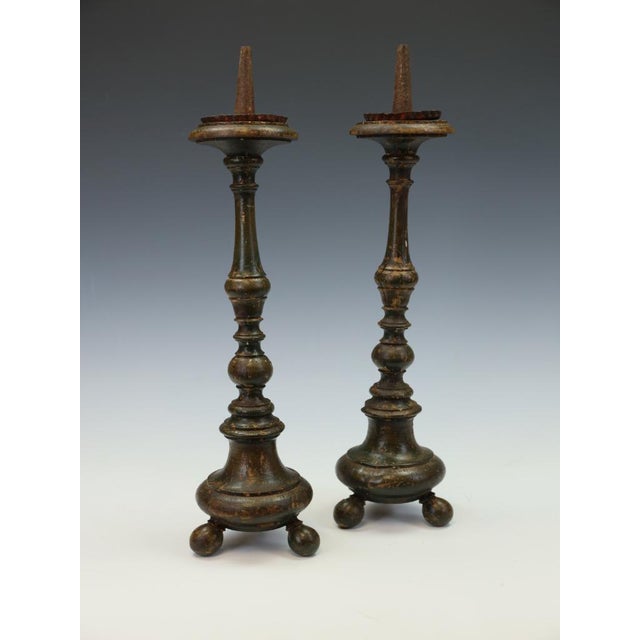 A rare pair of french painted wood altar candlesticks, c. 1780–1820 late 18th / early 19th century a distinguished and...