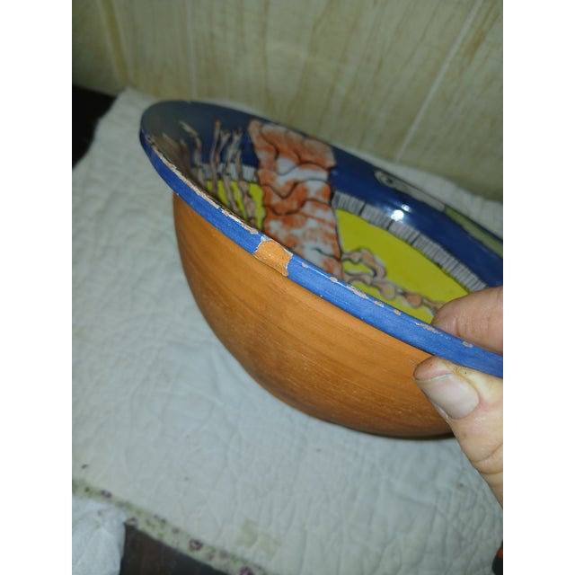 Handmade 1960s folk art ceramic bowl with a glazed interior featuring a vibrant, hand-painted lobster design. The painting...