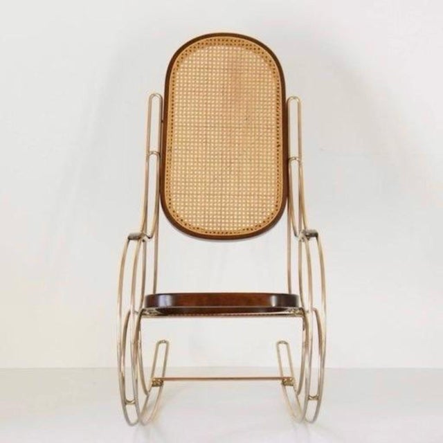 1970s Rocking Chair, Brass & Wicker, Mid-Century Modern Charmy rocking chair from the 1970s inspired by the iconic...