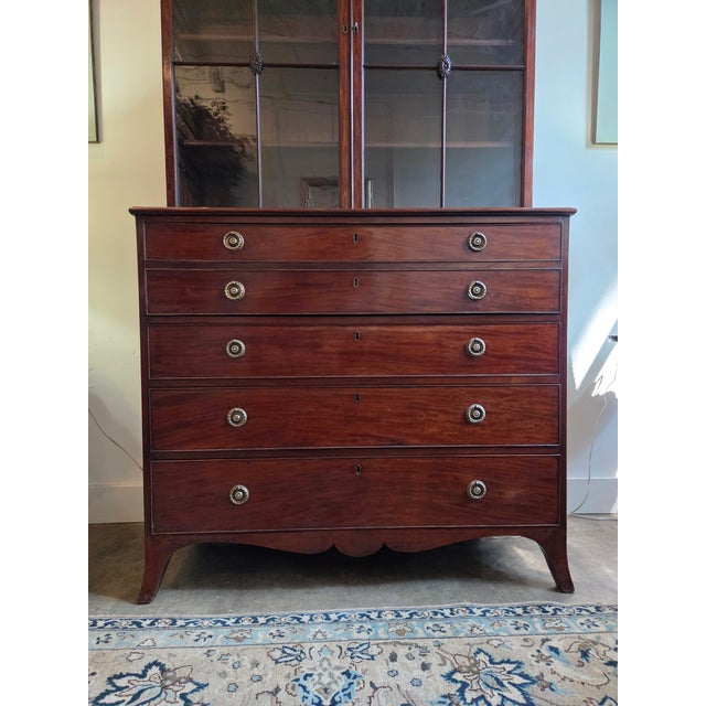 This Georgian Mahogany Astragal Glazed Secretaire Bookcase on Swept Bracket Feet is a very handsome piece. It would be...