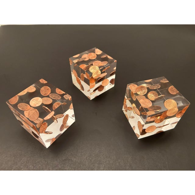 Fun set of three lucite penny cubes with 10 floating pennies inside each cube.