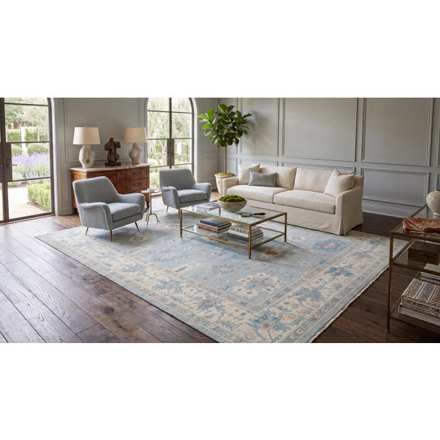Elevate your interior with this exquisite hand-knotted modern Oushak-style wool rug, crafted to bring timeless elegance...
