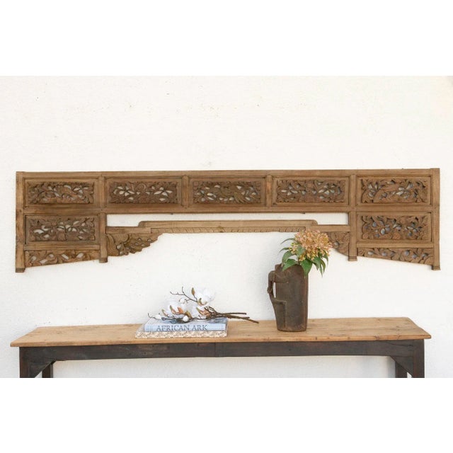 Imagine a time long past, perhaps in a sun-drenched courtyard of a grand noble's house in Java, or adorning the tranquil...