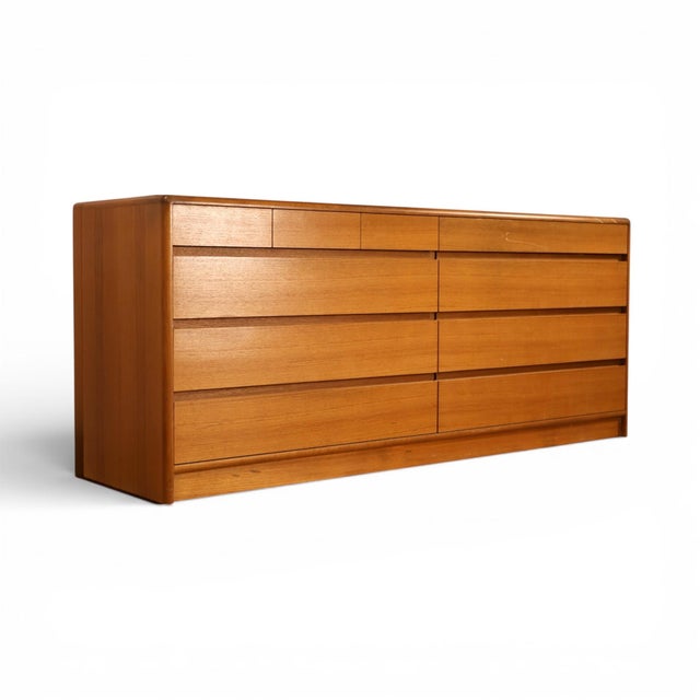 This 1970s Danish Modern lowboy dresser by Nordisk Andels-Eksport of Denmark exemplifies the quiet precision and warmth of...