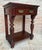 Console table auxiliary furniture made of solid walnut wood. Its Victorian style gives elegance to the room. It has a...