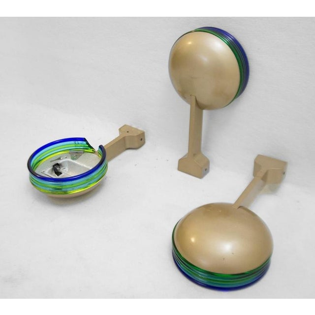 Set of 3 Murano wall lamps - 1980s Wear consistent with age and use.Measures : Ø22cm D:42cm Materials : Glass - Metal Up...