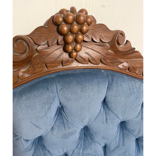 Beautiful antique Victorian Eastlake parlor settee featuring a richly carved walnut frame and later reupholstered deep...