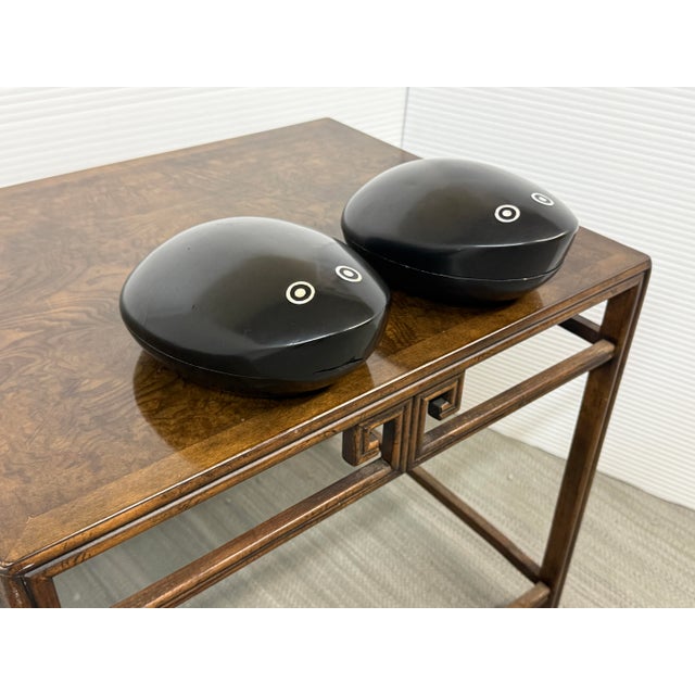 Design Plus Gallery presents a Pair of Trinket Boxes of Polished Wood. These ebony toned boxes are in shape that could...