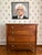 The swirling walnut wood grain and the bold reeding on the sides of this chest give it a distinctive personality. Along...