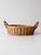 Vintage handwoven wicker gathering basket featuring an oval form, twisted side handles, and warm natural tones. Perfect as...