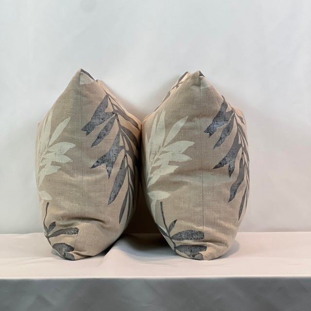 Custom-tailored 20” feather/down pillows in painted linen adorning large gray and white leaves. Hidden zipper closures....