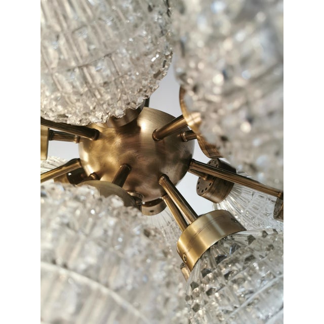 Beautiful 20-light chandelier with a high-quality bronze and brass structure, and thick cut Bohemian crystal diffusers...