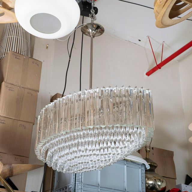 Chandelier composed of multiple tiers/rows of triangular crystal prisms by Venini. UL certified.