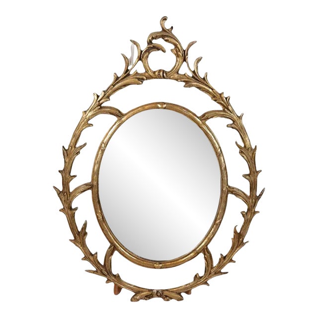 Giltwood Oval Mirror With Scroll Motif For Sale