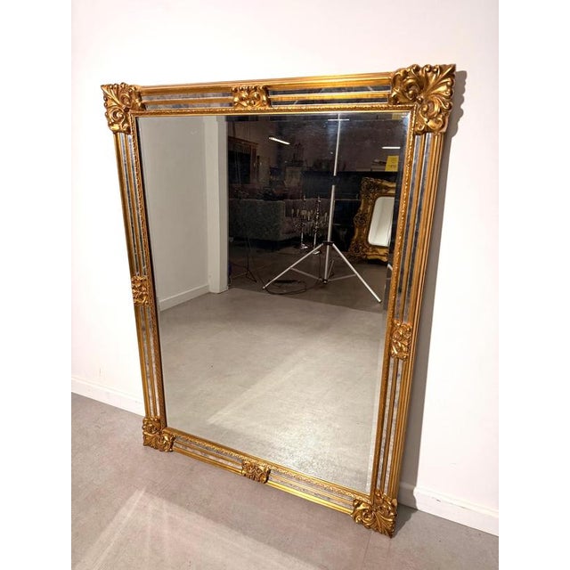 Elegant vintage wall mirror by Deknudt , made in Belgium. This decorative rectangular mirror features a richly detailed...