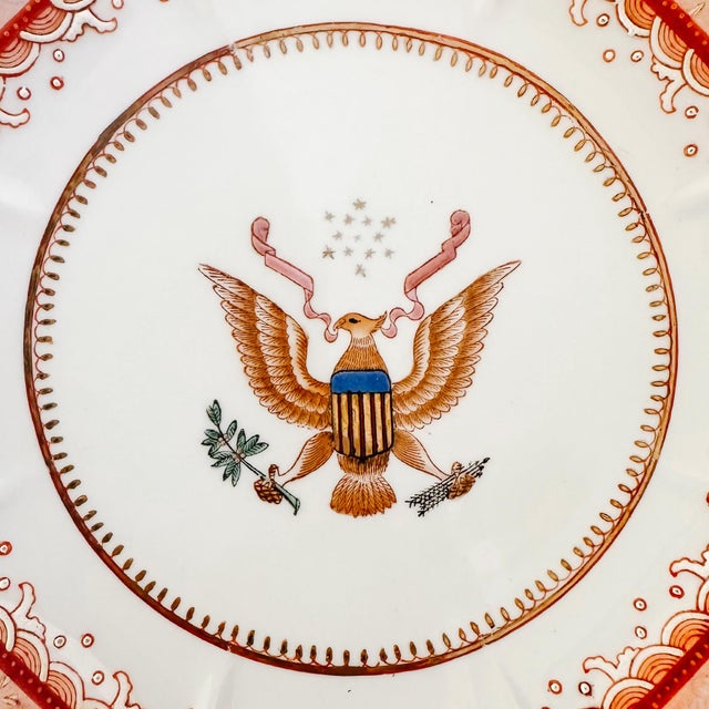A mid-century Chinese Export porcelain armorial plate depicting a rendition of the Great Seal Of the United States....