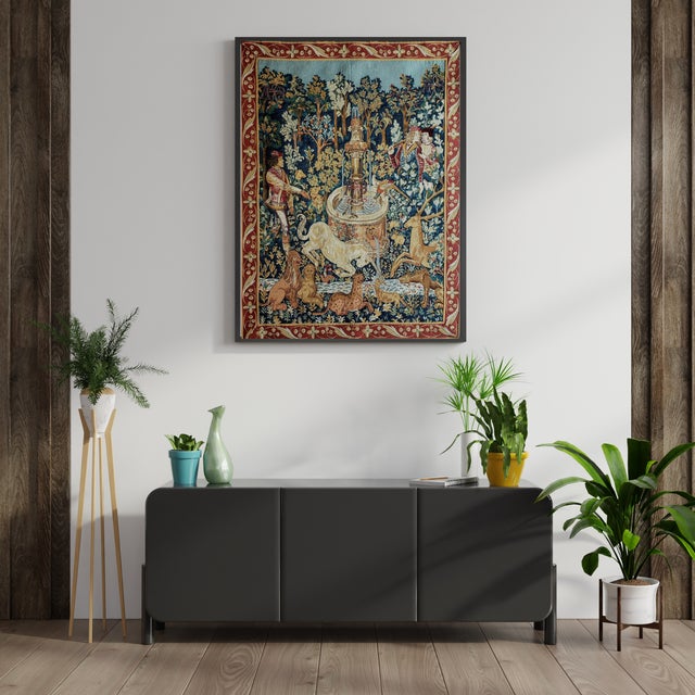 A striking, large-format vintage French Jacquard woven wall tapestry titled "La Licorne à la Fontaine" (The Unicorn at the...