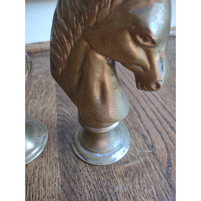 Offered are a pair of vintage solid brass bookends. They are nicely done and stand 7 1/4" tall. They are tarnished giving...