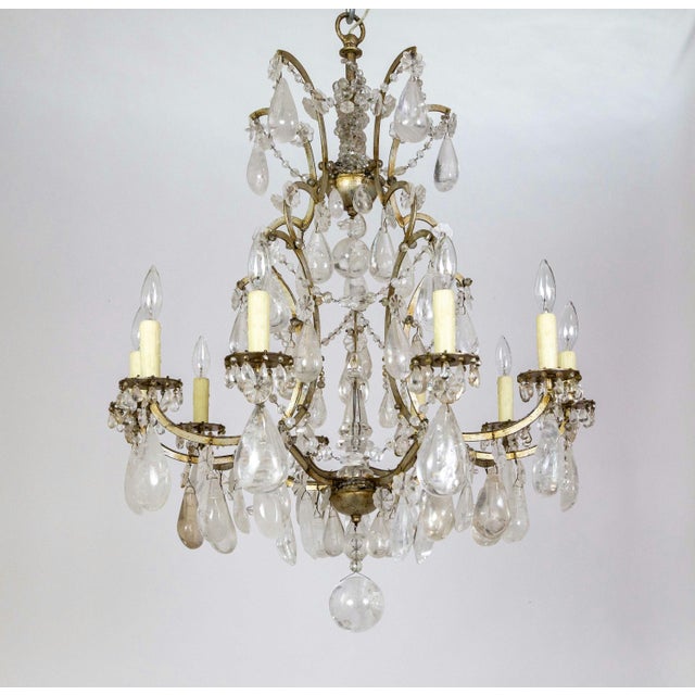A beautiful and well-balanced French, white-gold over iron chandelier from the mid-19th century; decked with massive rock...