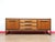A stunning piece of furniture with sleek mid century style, this Vintage Teak British Credenza Sideboard in the manor of...