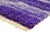 A rug that catches the eye instantly — a repeating honeycomb texture rendered in deep, saturated purple, breaking into...