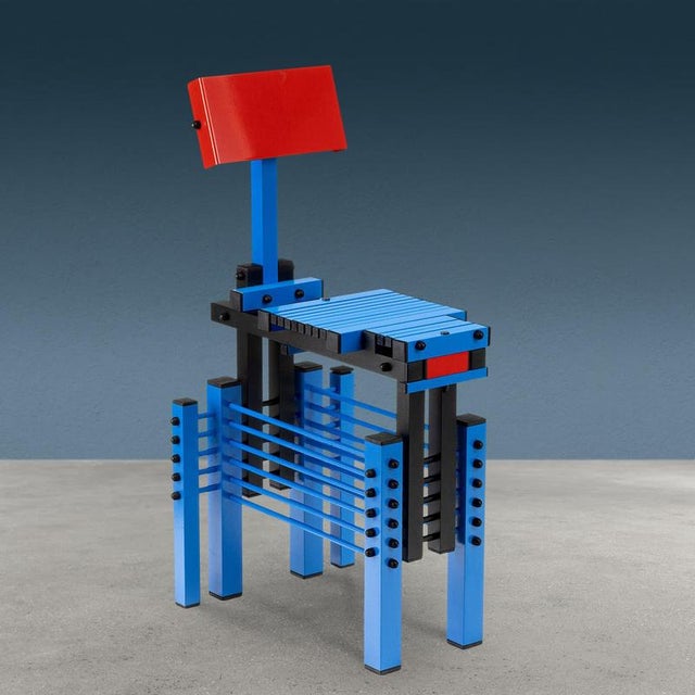 Post-modern chair designed and created by Anacleto Spazzapan by joining metal strips of different sizes enameled in red,...