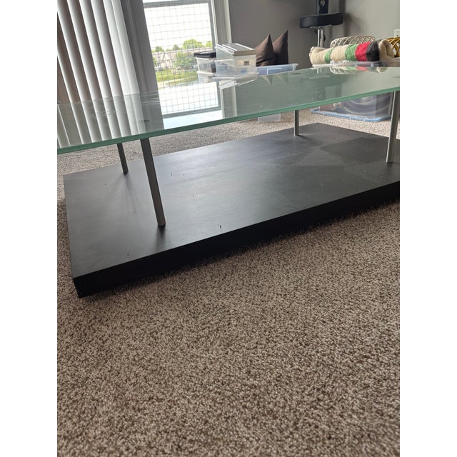 Glass and wood coffee table designer by Pascal Mourgue. In excellent condition. Modern style with quality craftsmanship.