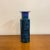 Mid-century modern italian ceramic vase in a beautiful bright blue. There is a city scape imprinted to base and has a...