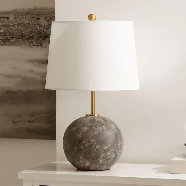 Introducing our sophisticated CLA Table Lamp, an embodiment of modern styling meets traditional craftsmanship. The lamp...
