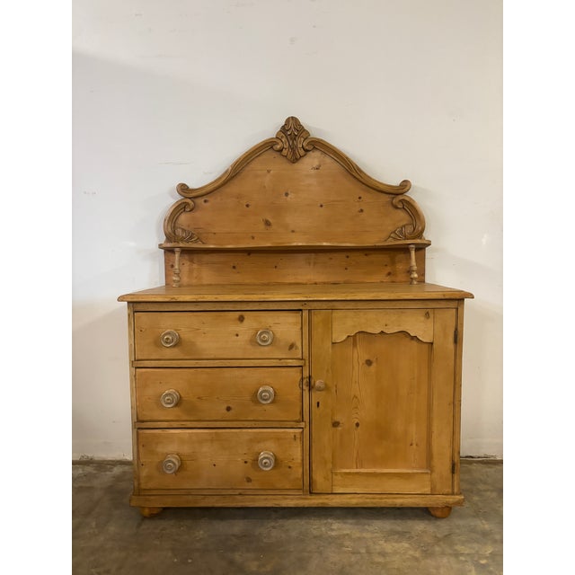 Some pieces of English country furniture seem to carry their history right on the surface, and this 19th century pine...