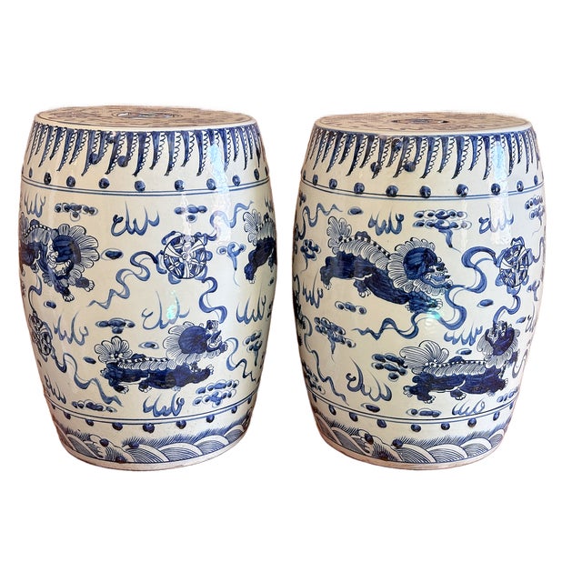 This is a pair of beautiful blue and white porcelain garden stool with a vibrant design of Dancing Foo Dogs and Treasures....