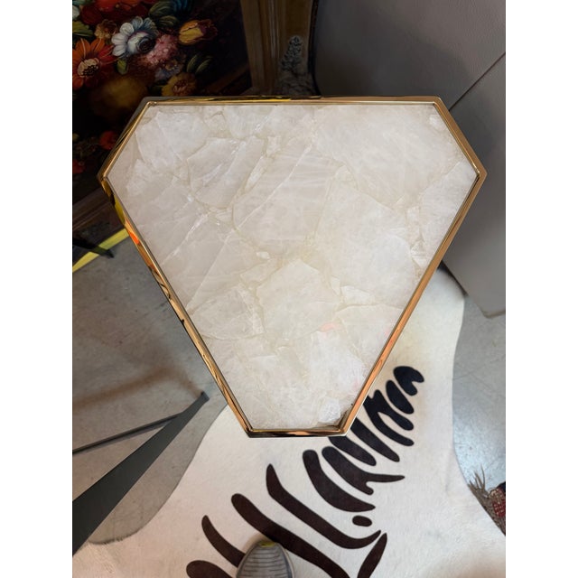 Brass abstract angular side table with quartz top. The shape is fantastic and each side different from the side angle next...