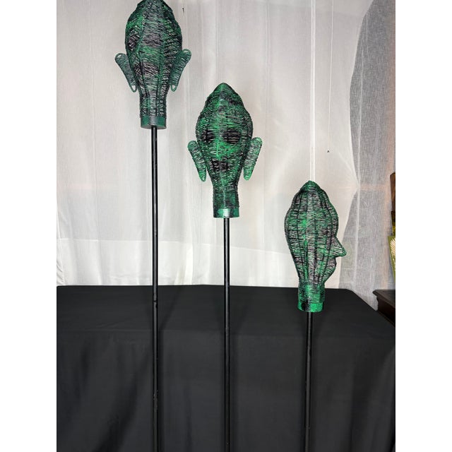 These 3-metal handmade sculptural human heads are woven from wire. Each head is mounted on a metal pole with a circular...