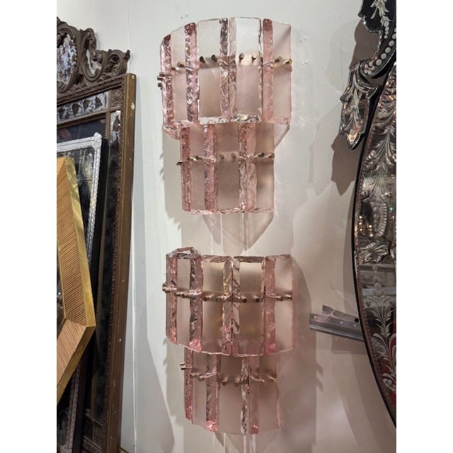 Pair of modern Murano pink ice block wall sconces. Murano pink ice block wall sconces bring a bold yet romantic glow to...