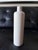 Elegant tall ceramic bottle with a simple, elongated silhouette and softly rounded shoulders. Finished in a warm matte...