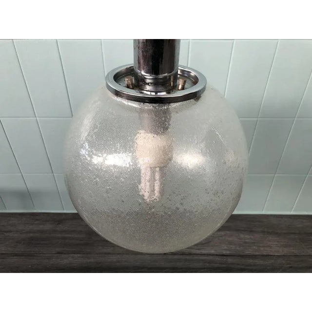 Chandelier with Murano glass sphere lampshade pullegous glass. Produced in Italy in the 60s from Sankey Targetti This...