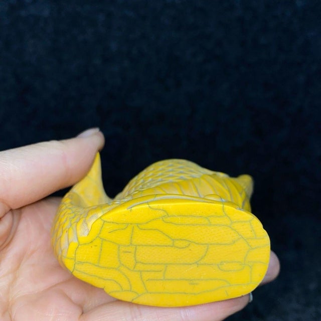This unique vintage snuff bottle is carved in the shape of a leaping fish, a traditional Chinese symbol for abundance and...