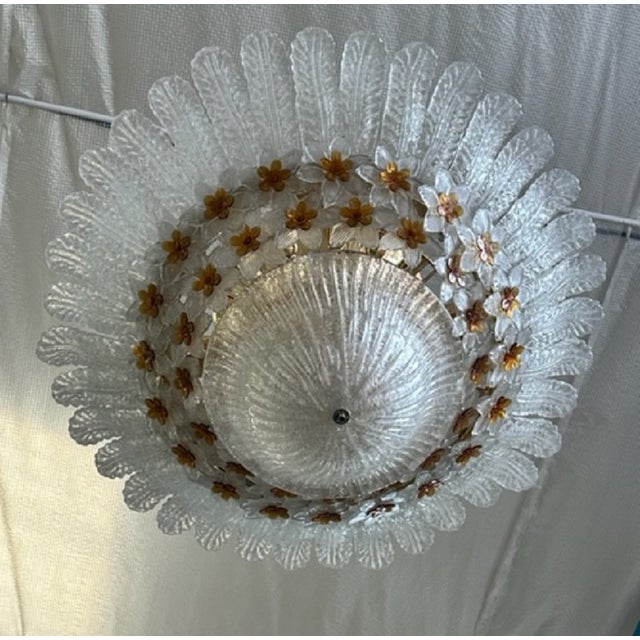 Great Murano glass chandelier from the 70s/80s. Ceiling light with flowers and leaves, in white satin glass, and amber...