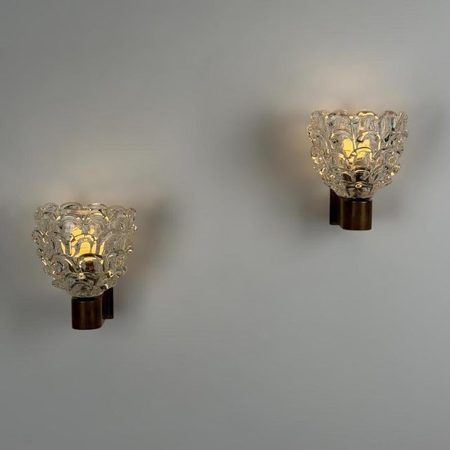 An exceptional and highly collectible pair of "Festoni" wall sconces designed by Ercole Barovier for Barovier & Toso in...