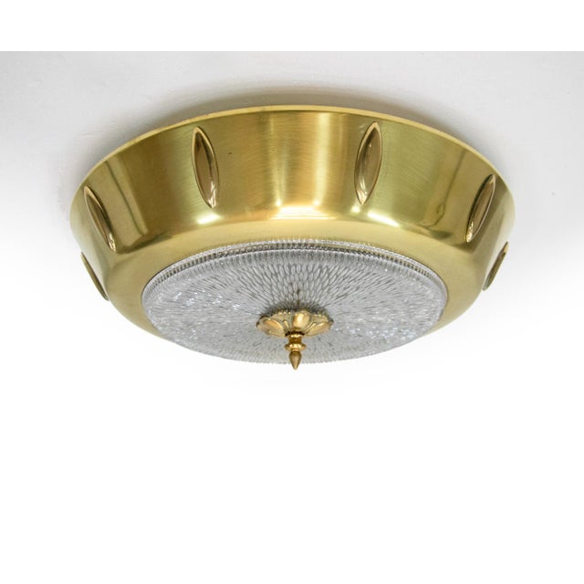 European Art Deco brass and textured glass flush light. Manufacturer: unknown. Execution: round. Style: art deco, mid...