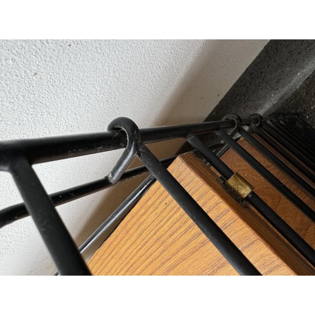 Small modular bookcase designed by Nisse Strinning. Produced by String Design in the 50s/60s. Made of teak and black...