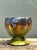 This vintage drip glaze ceramic pedestal bowl showcases a vibrant, glossy finish with a skillful application of glaze in...