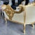 Lovely two person settee fully refinished in new 24K gold + new high end damask fabric. This is a beautiful settee that...