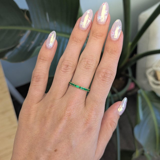 This elegant band features vibrant Zambian emerald stones set in a sleek minimalist design, crafted in solid 14K gold. The...